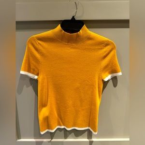 Women’s short sleeved gold turtleneck sweater